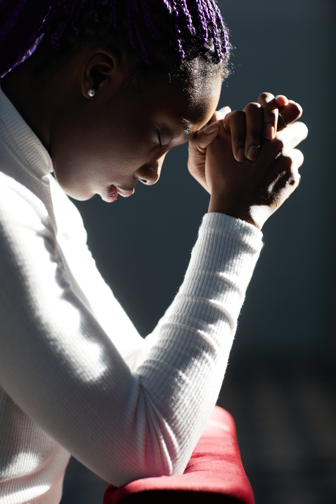 Woman praying in church